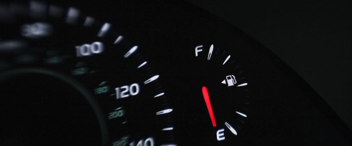 Close up of gas gauge on empty in a car.